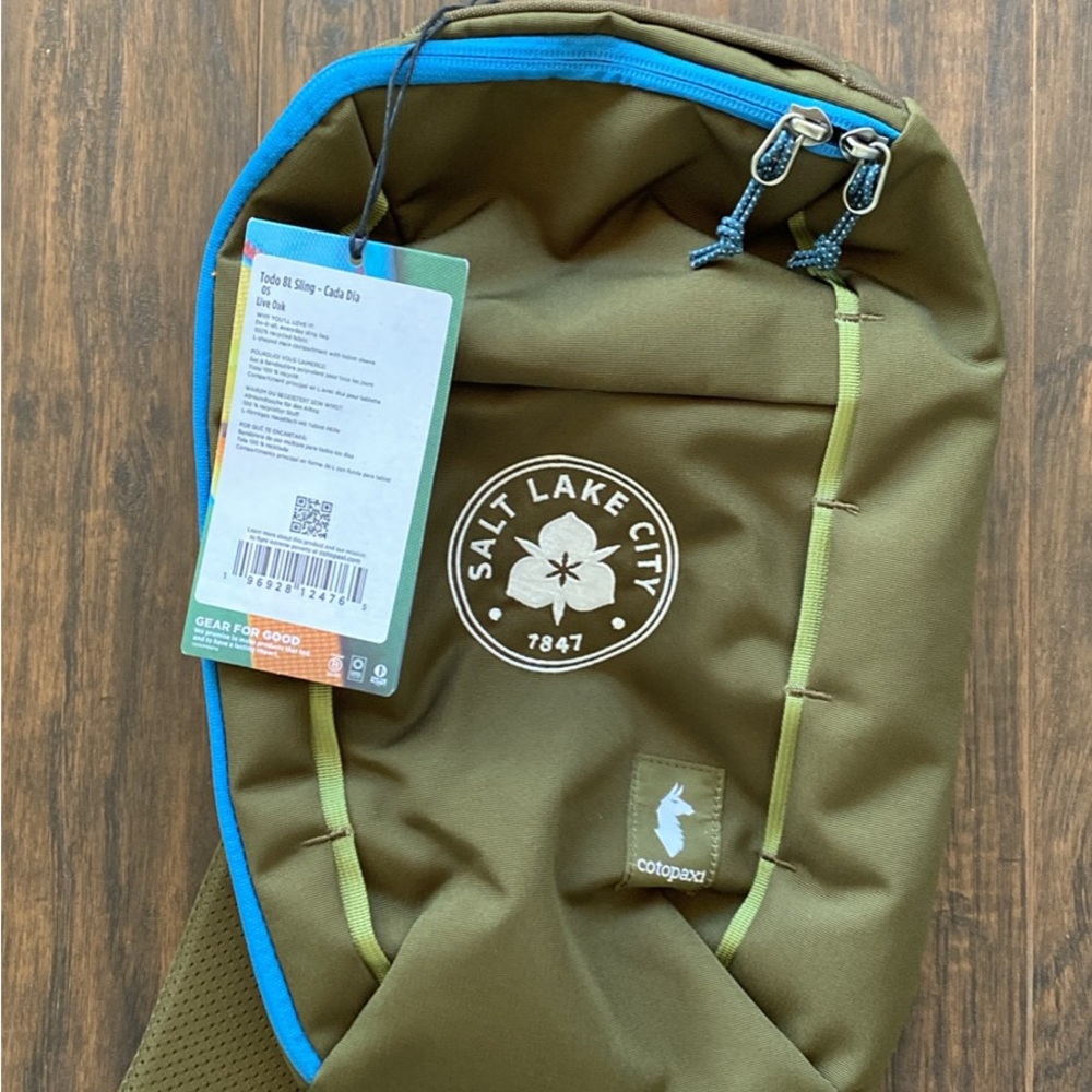 Cotopaxi Olive Green Sling Bag with Blue Accents - 8L